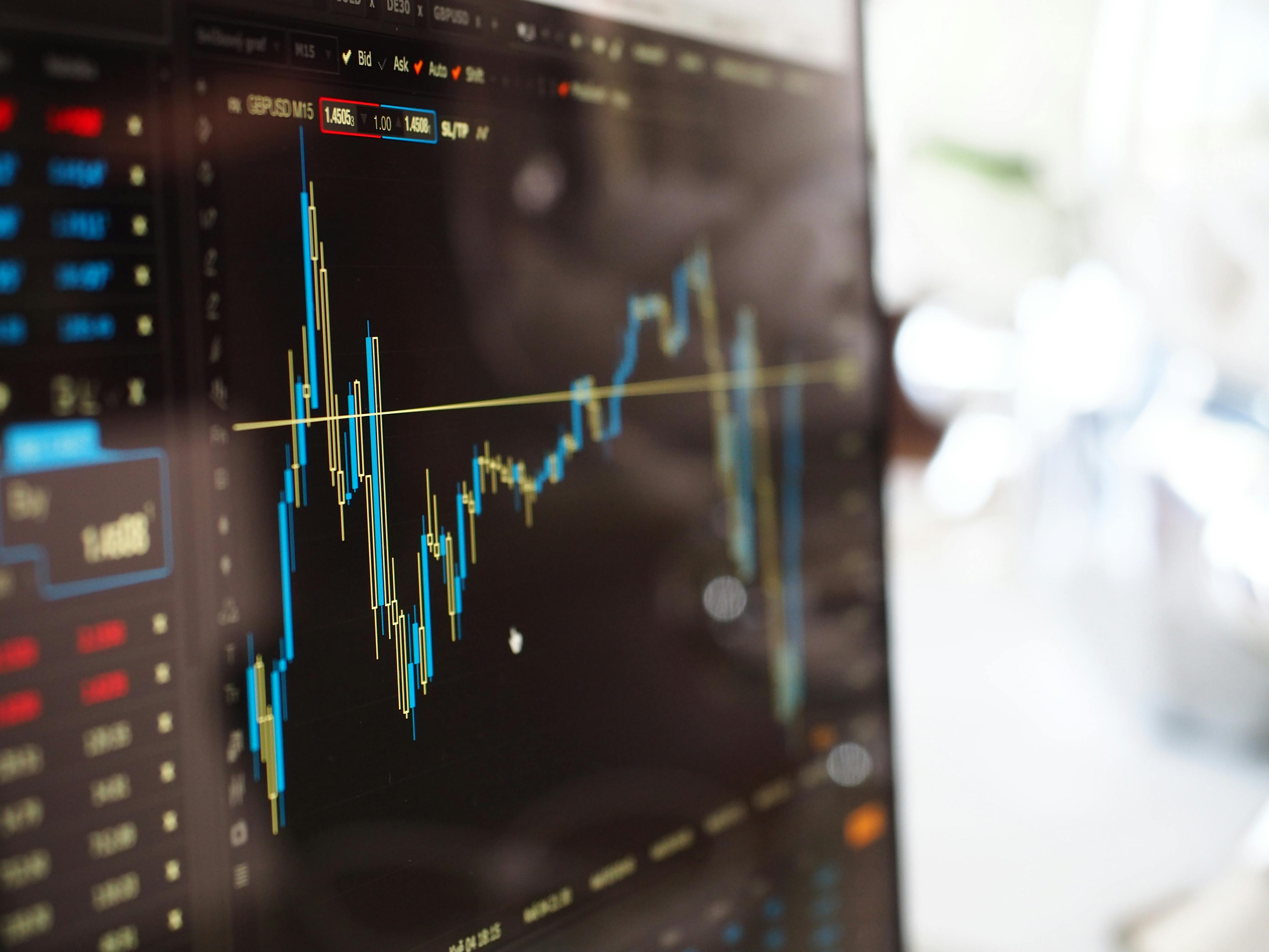pexels-photo-159888-159888 Detailed view of financial trading graphs on a monitor, illustrating stock market trends.