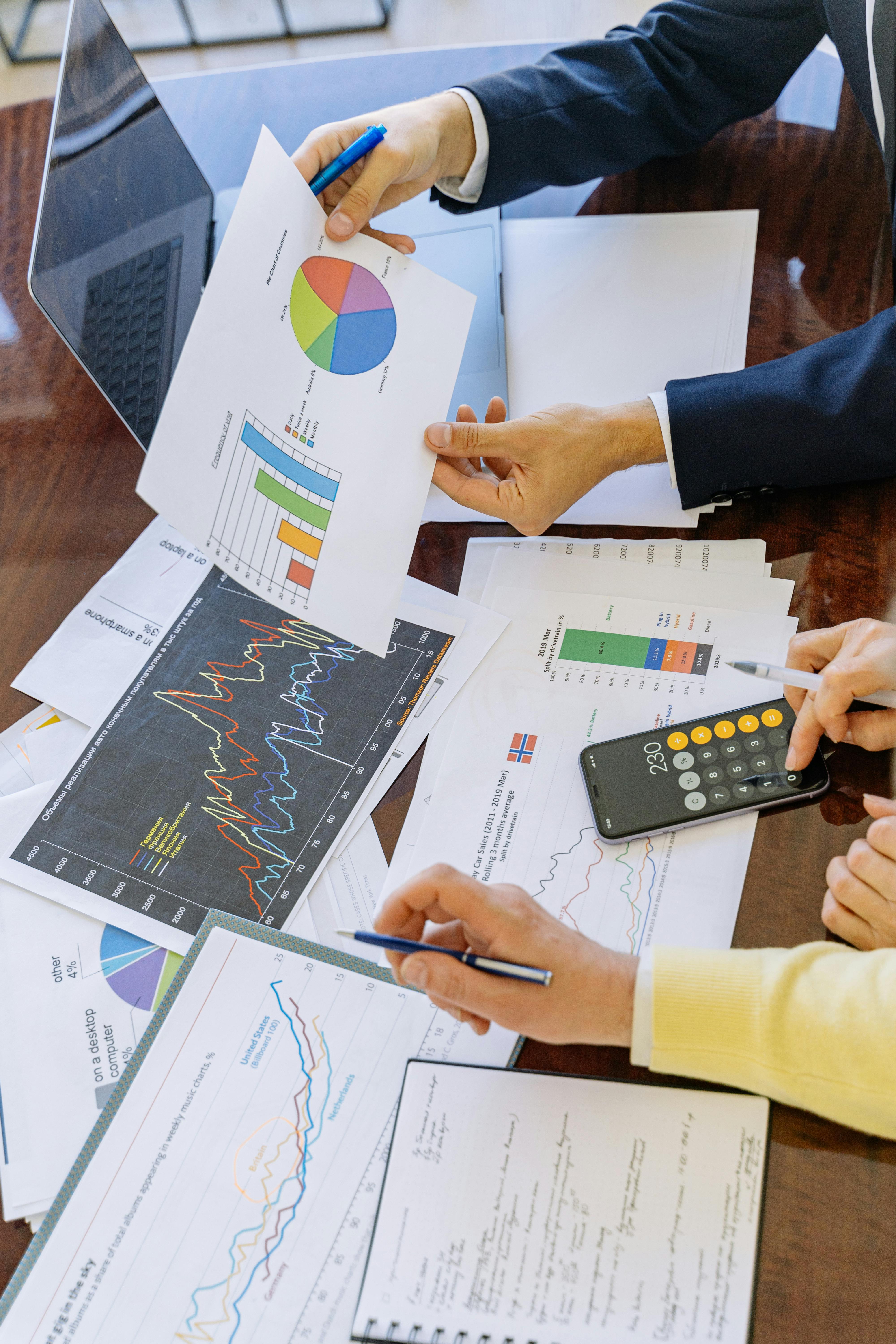 pexels-photo-5816283-5816283 Business professionals analyzing financial charts and graphs during a meeting.
